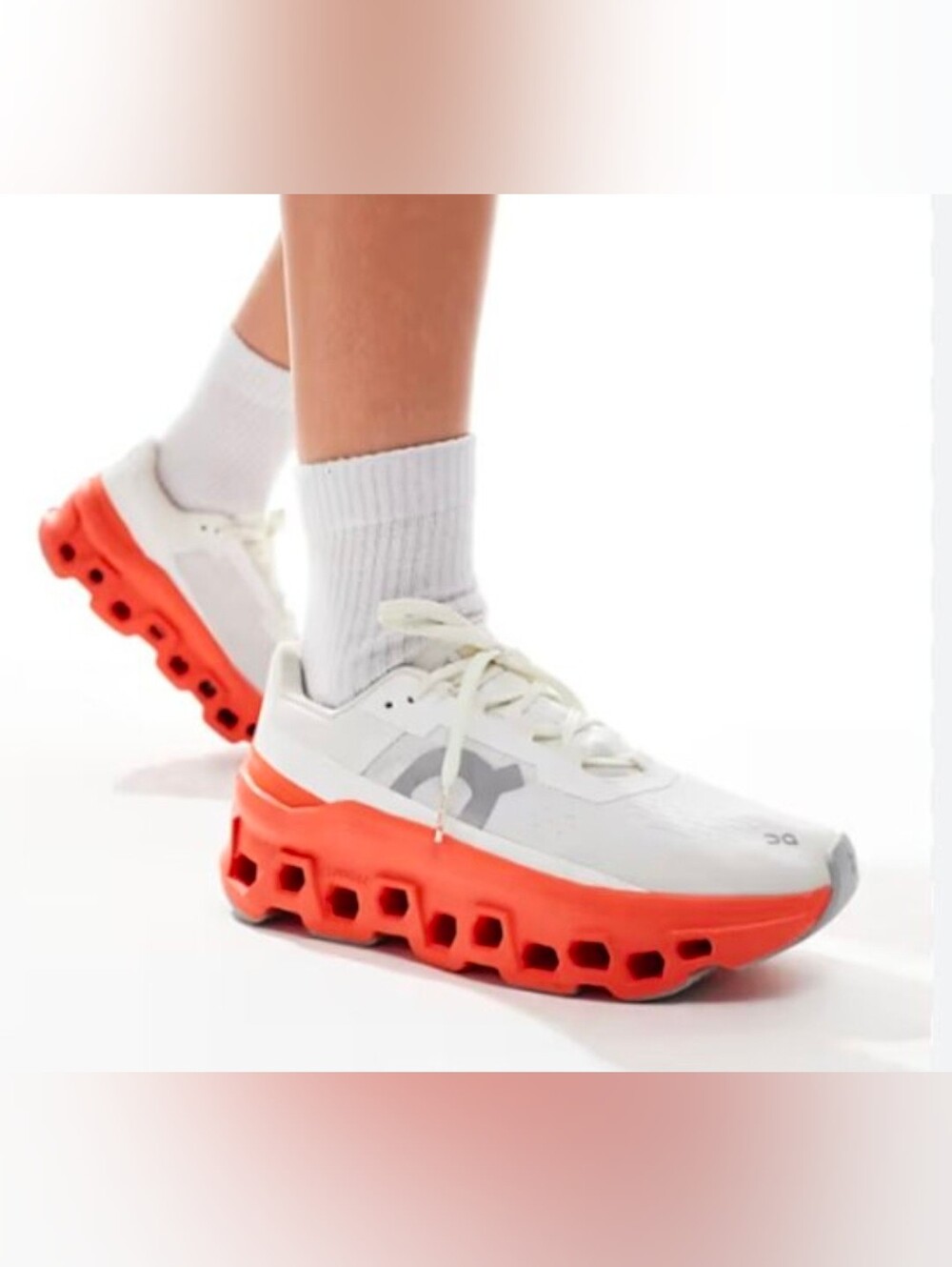 On Running Women's White Sneakers with Bright Orange Midsole